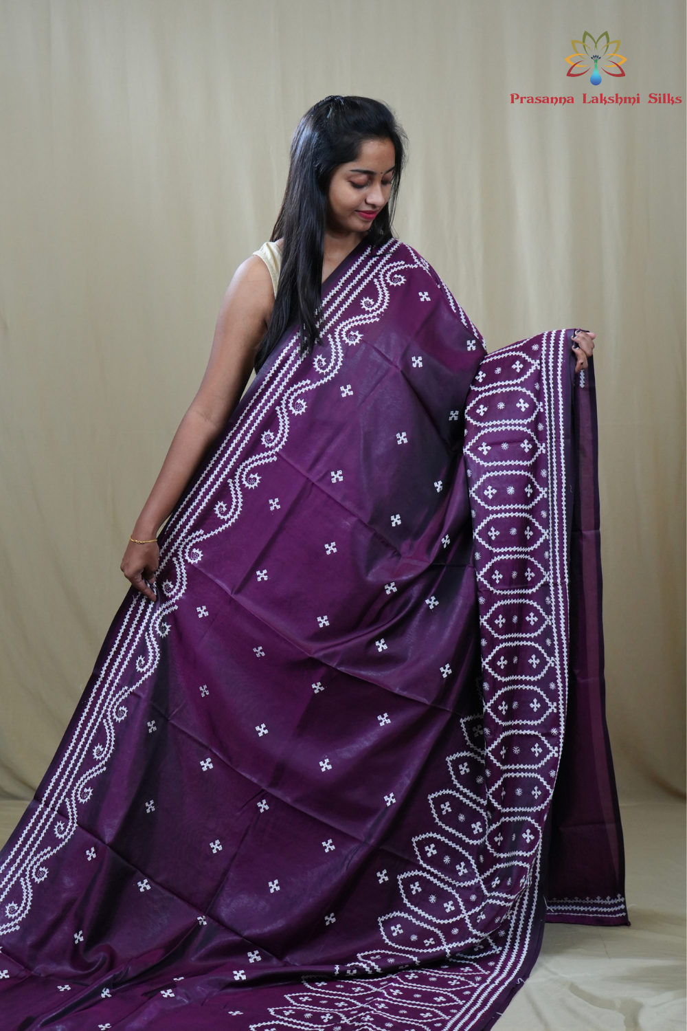 Traditional semi silk saree featuring beautiful hand Kutch work borders and artistic design.
