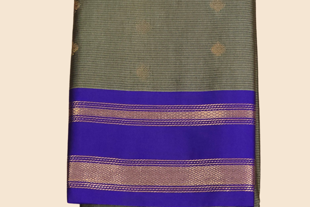 Handloom semi Gadwal saree featuring rich brocade pallu and contrast blouse
