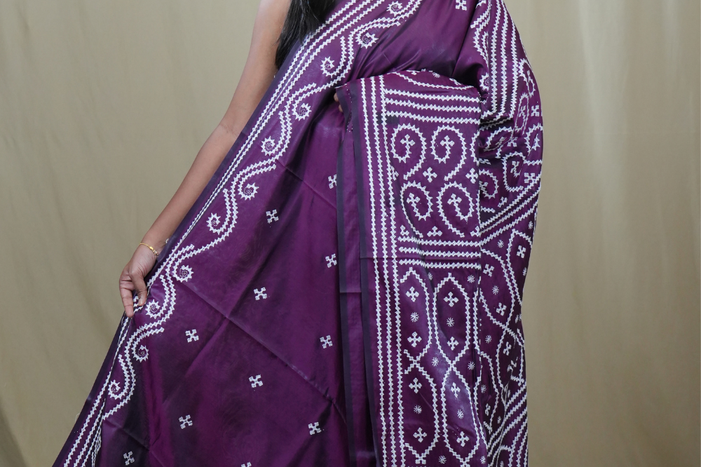 Semi Bangalore Silk Saree with all-over Kutch work motifs and rich embroidered pallu.
