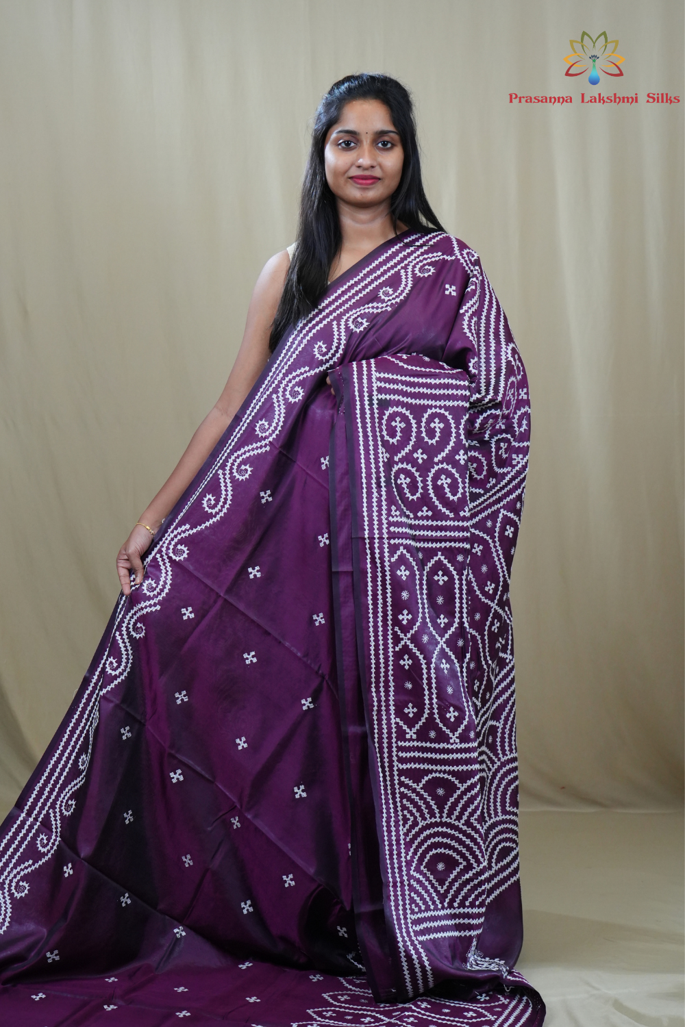 Semi Bangalore Silk Saree with all-over Kutch work motifs and rich embroidered pallu.

