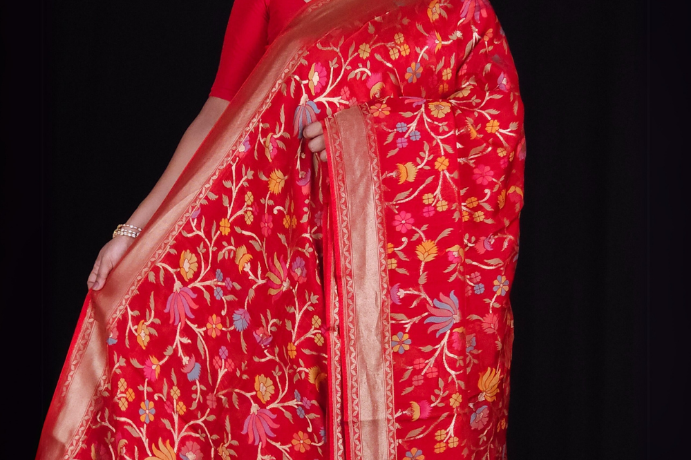 “Elegant floral organza saree with zari border”