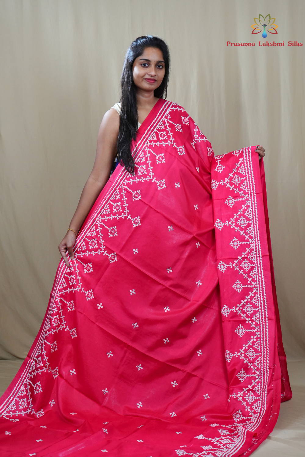 Traditional semi silk saree featuring beautiful hand Kutch work borders and artistic design.

