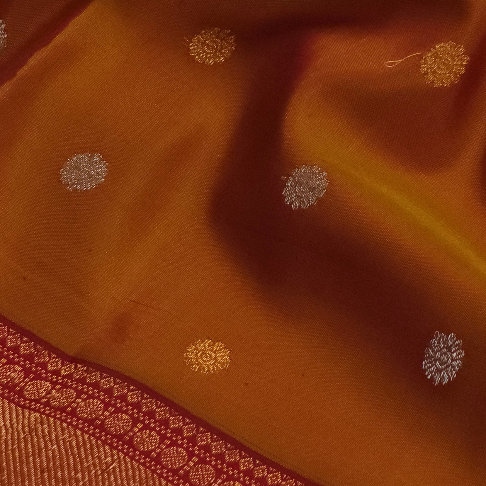 Premium Gadwal Silk Saree with woven zari motifs, luxurious brocade pallu, meenakari turning border, and matching contrast blouse.
