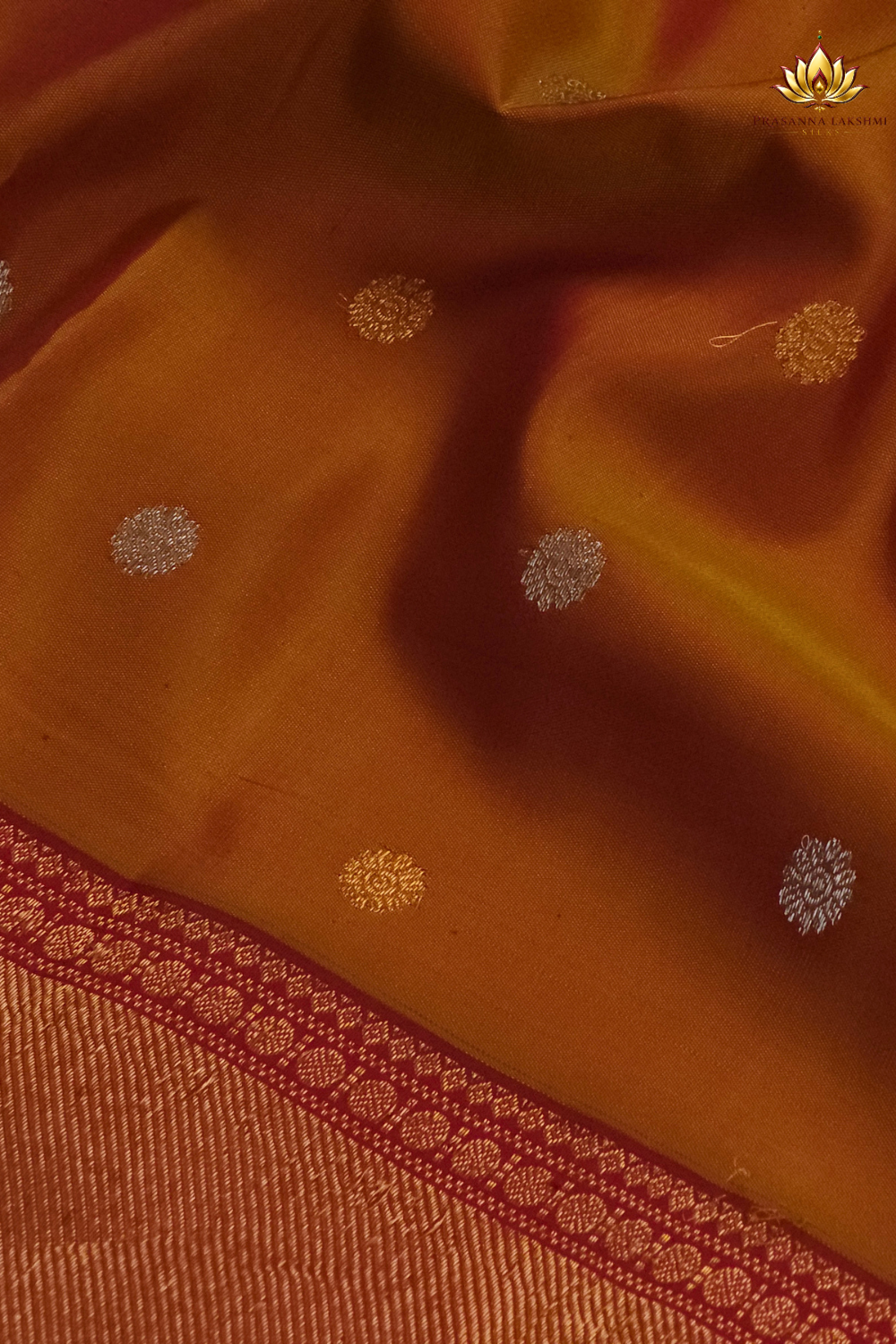 Premium Gadwal Silk Saree with woven zari motifs, luxurious brocade pallu, meenakari turning border, and matching contrast blouse.
