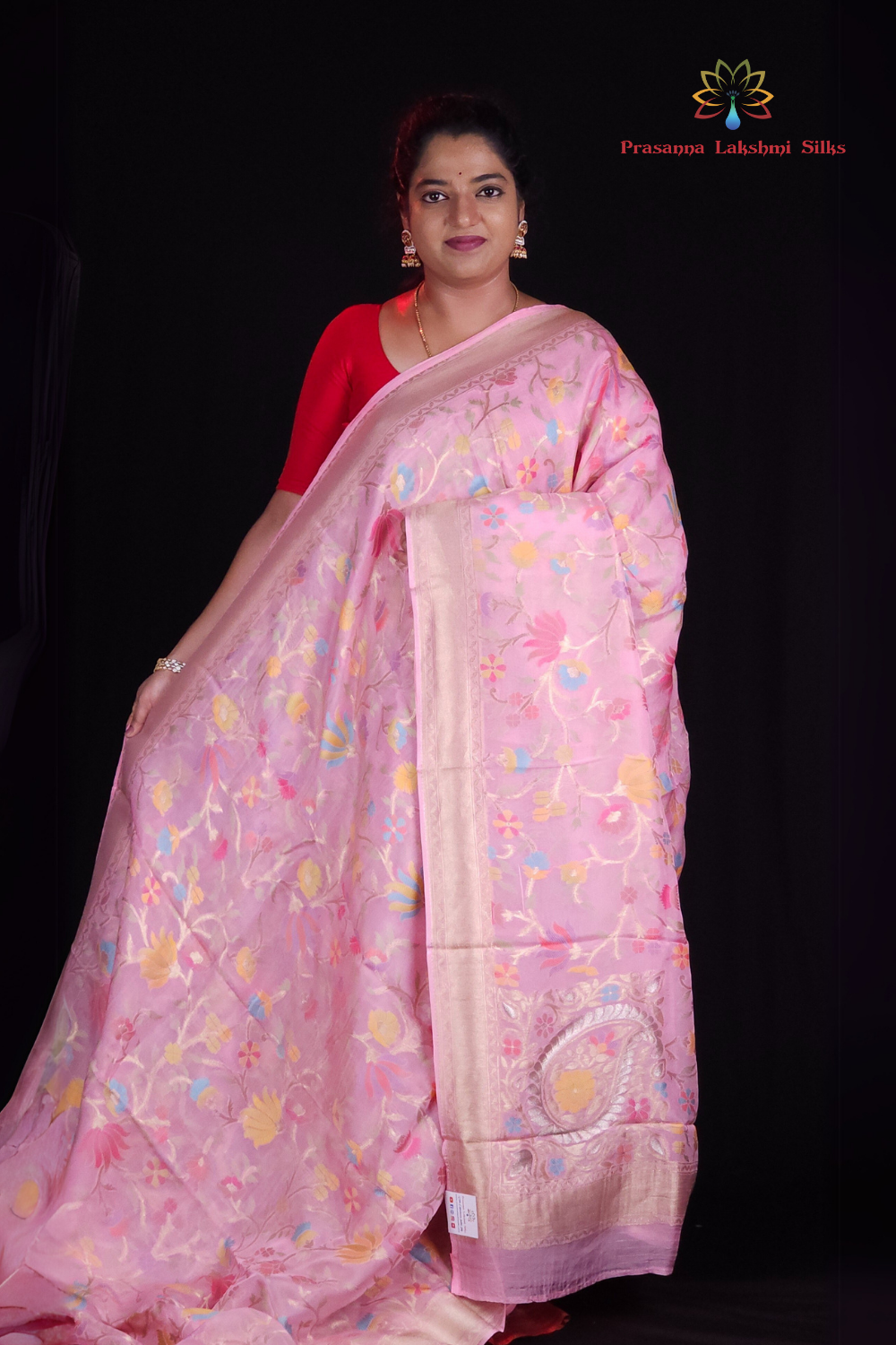 “Elegant floral organza saree with zari border”