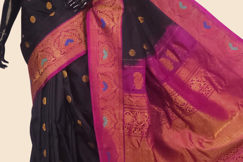 Gadwal Silk Saree featuring all-over zari motifs, intricate meenakari border, rich zari brocade pallu, and contrast blouse.
