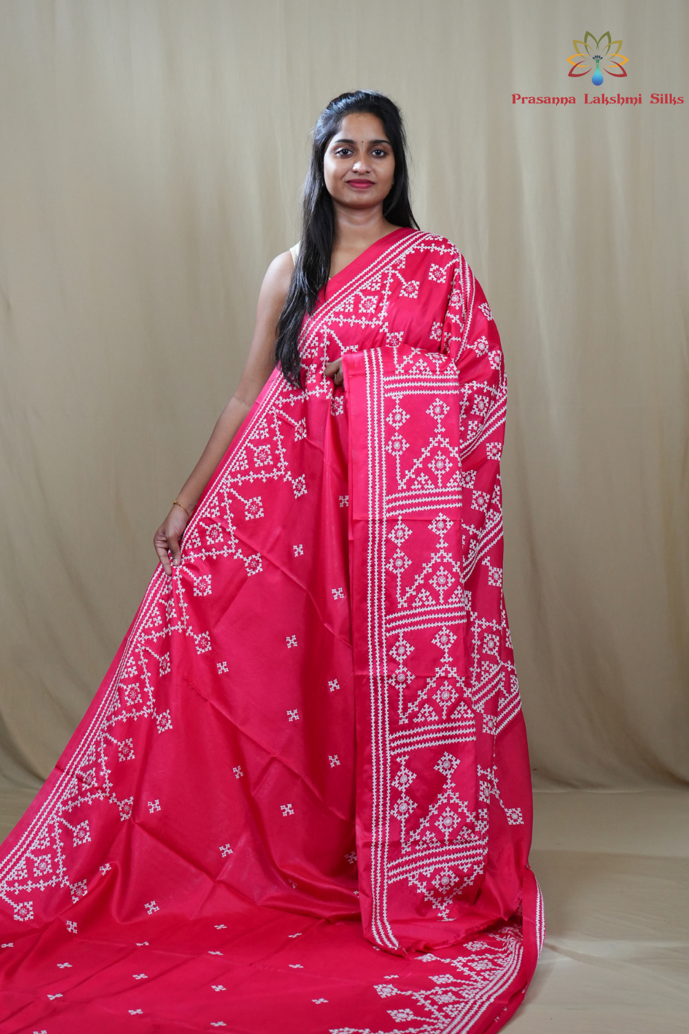 Semi Bangalore Silk Saree with all-over Kutch work motifs and rich embroidered pallu.
