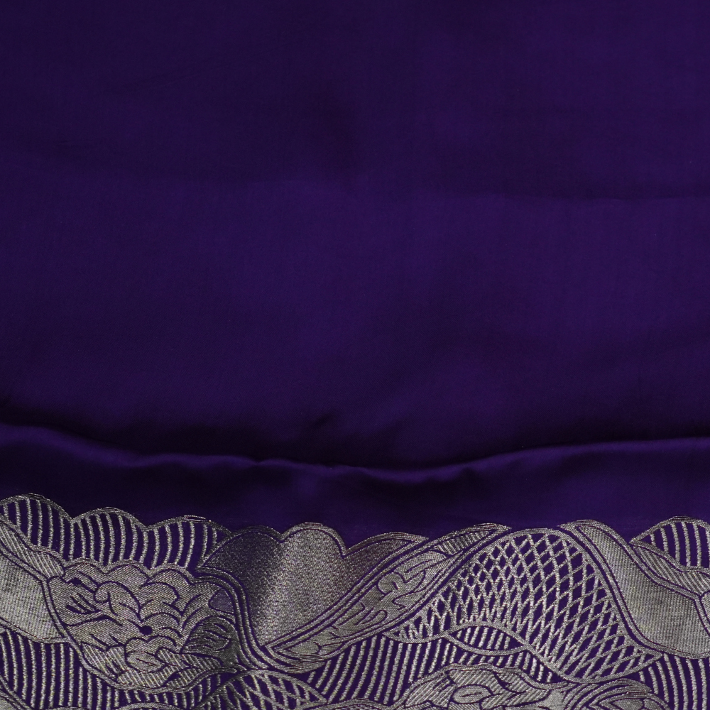 Festive Banarasi Mashru silk saree with intricate zari detailing and contrast blouse
