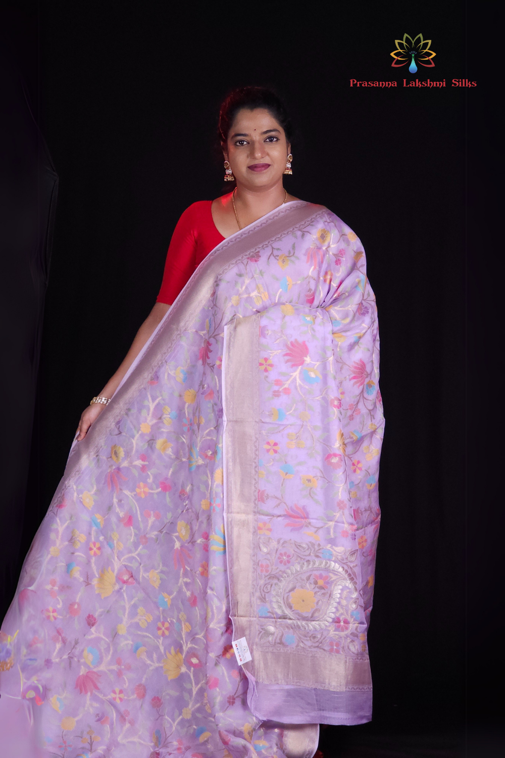 “Elegant floral organza saree with zari border”