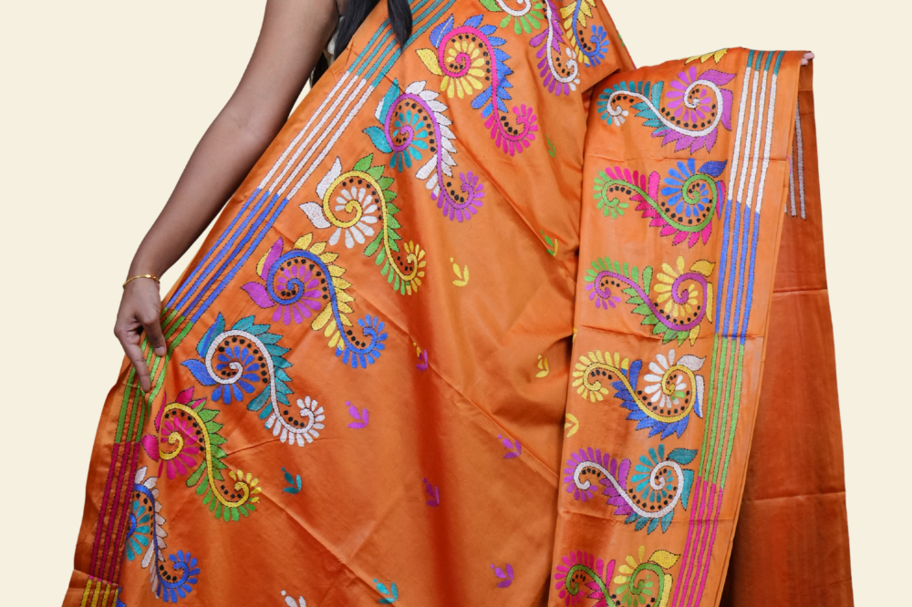 Elegant silk saree featuring Kantha work borders and detailed Kantha pallu design.