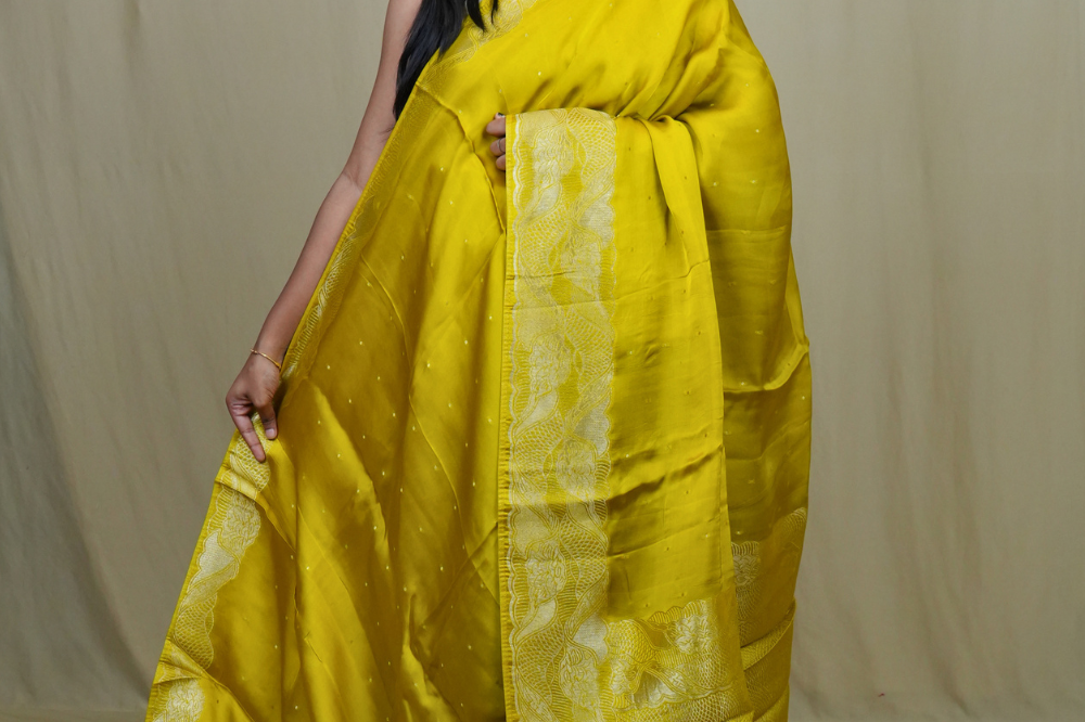 Banarasi Mashru saree with all-over tiny zari woven motifs and rich zari borders and pallu
