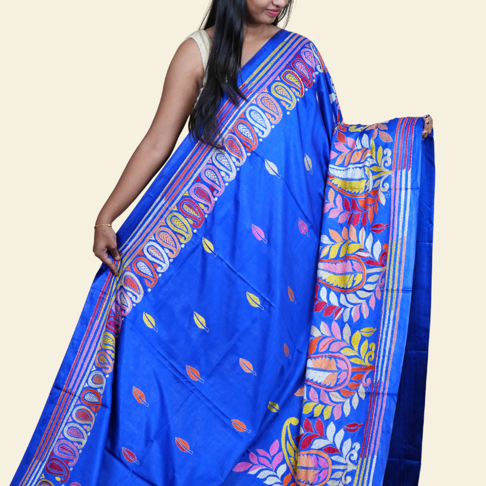 Elegant silk saree featuring Kantha work borders and detailed Kantha pallu design.
