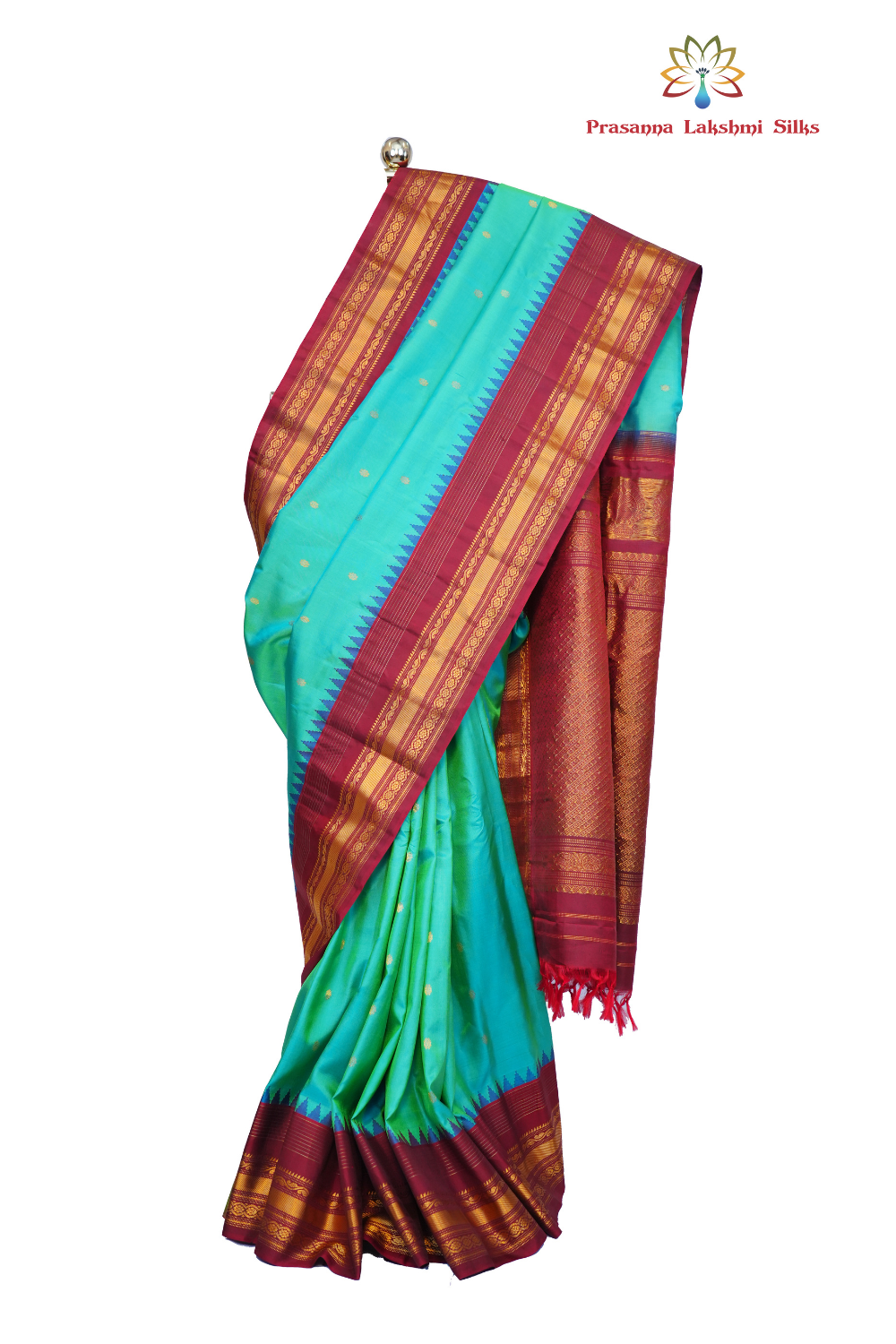 Handloom Gadwal pure silk saree with intricate small zari motifs and rich woven pallu.
