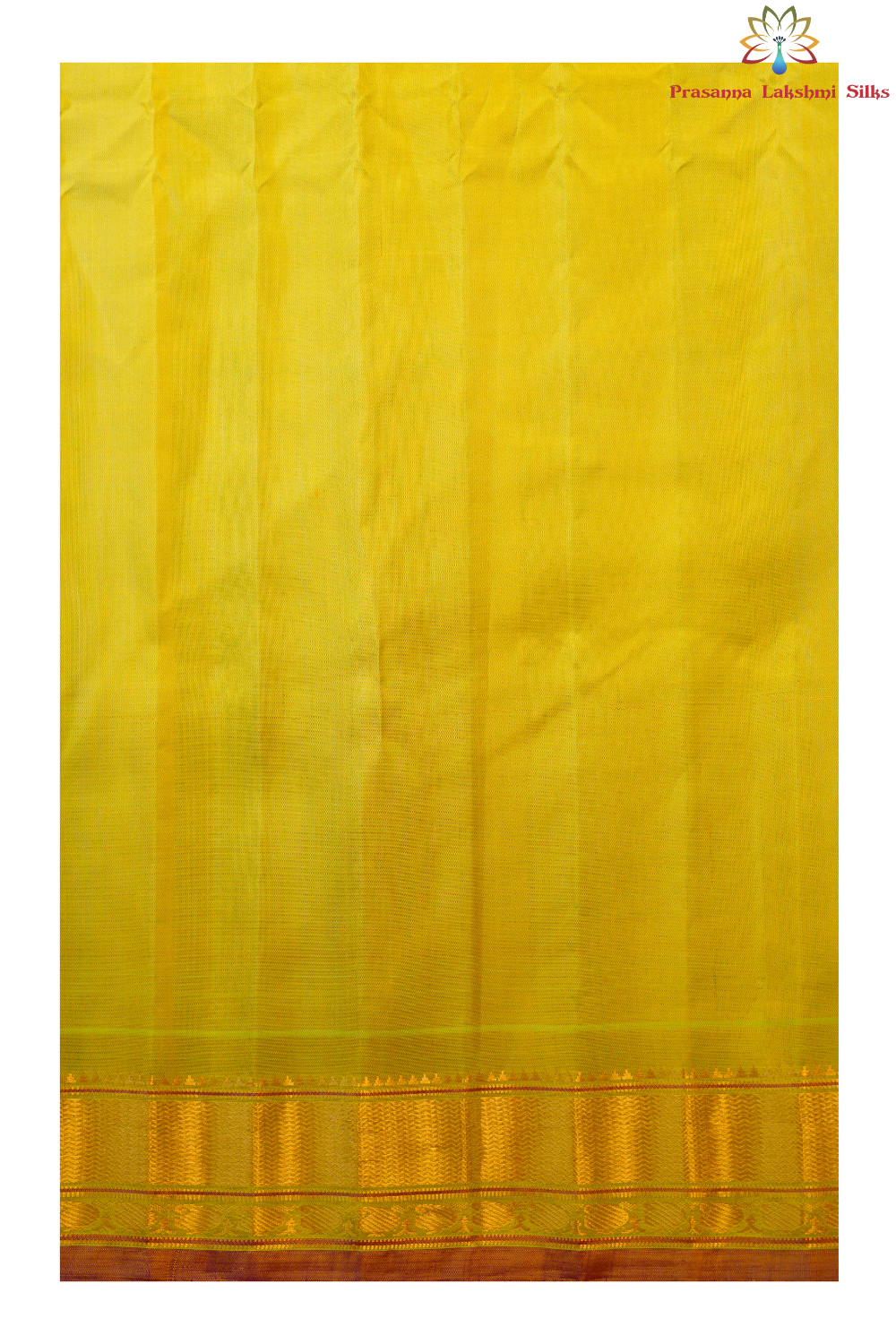 Traditional Gadwal silk saree featuring zari-woven borders and contrast blouse.
