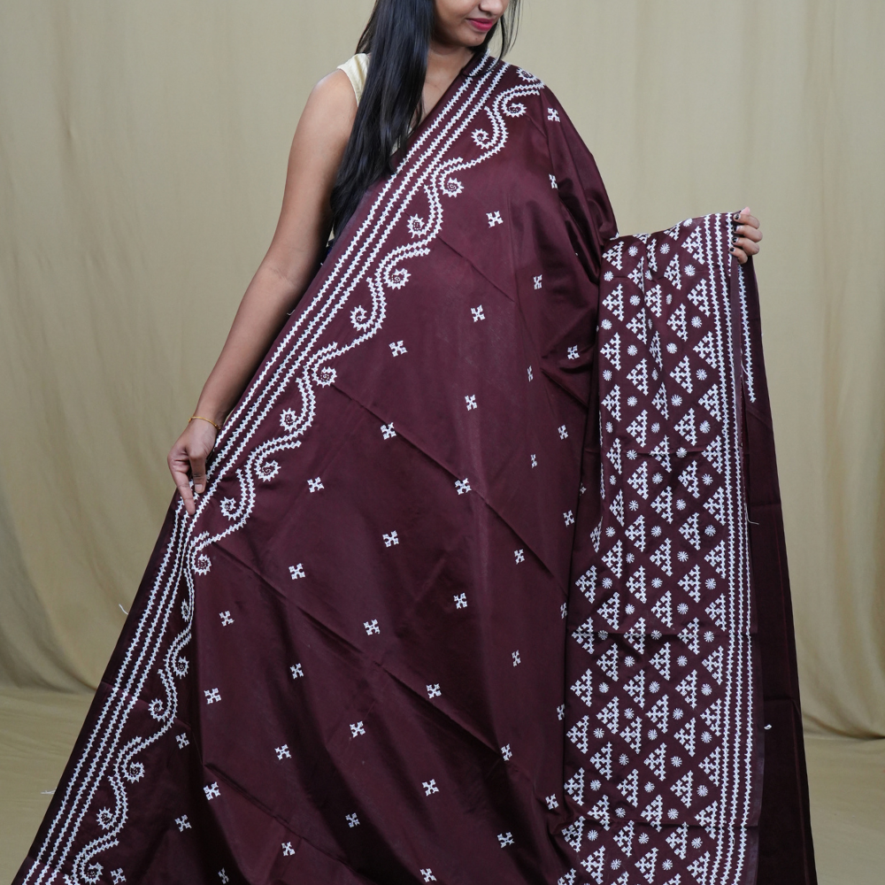 Traditional semi silk saree featuring beautiful hand Kutch work borders and artistic design.
