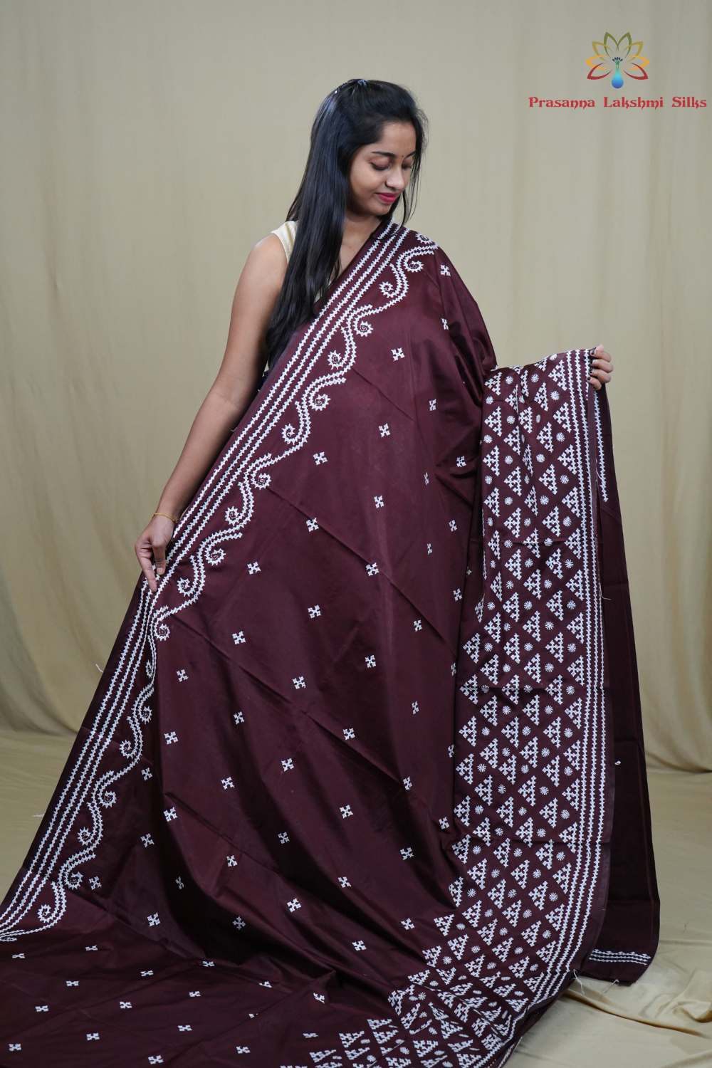 Traditional semi silk saree featuring beautiful hand Kutch work borders and artistic design.
