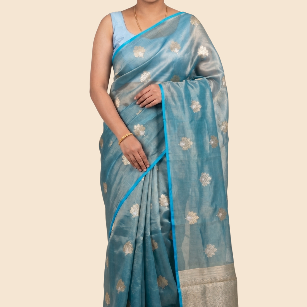 Kora tissue saree with allover gold flower motifs and silver highlights
