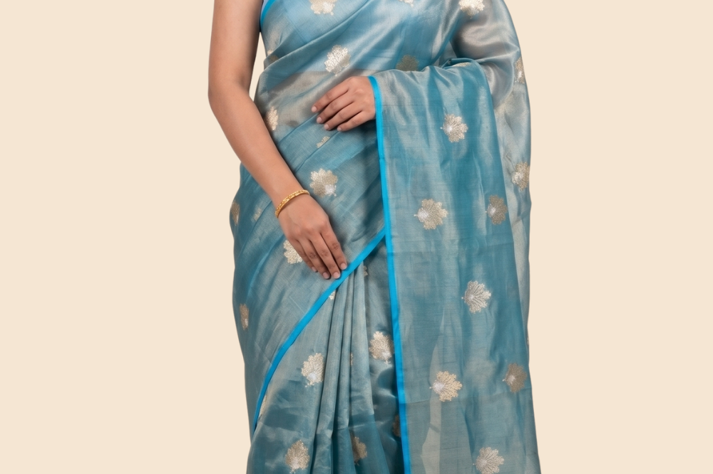 Kora tissue saree with allover gold flower motifs and silver highlights
