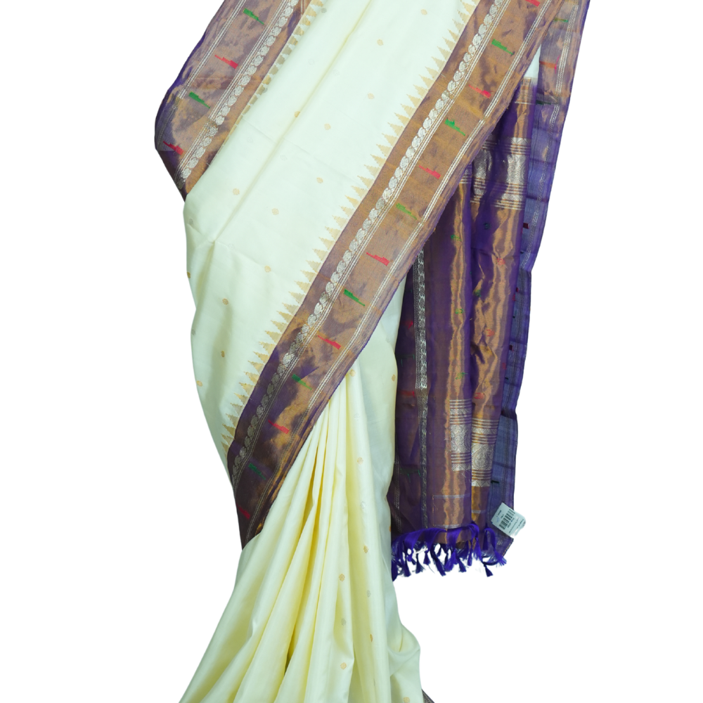 Handloom Gadwal pure tissue silk saree with intricate zari motifs and muniya borders.
