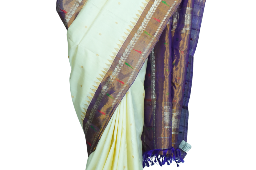 Handloom Gadwal pure tissue silk saree with intricate zari motifs and muniya borders.
