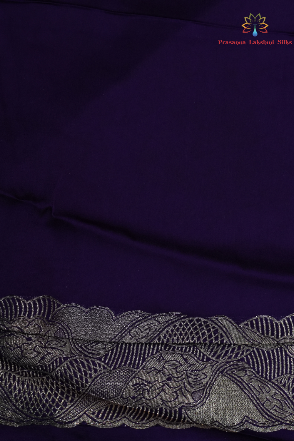 Festive Banarasi Mashru silk saree with intricate zari detailing and contrast blouse
