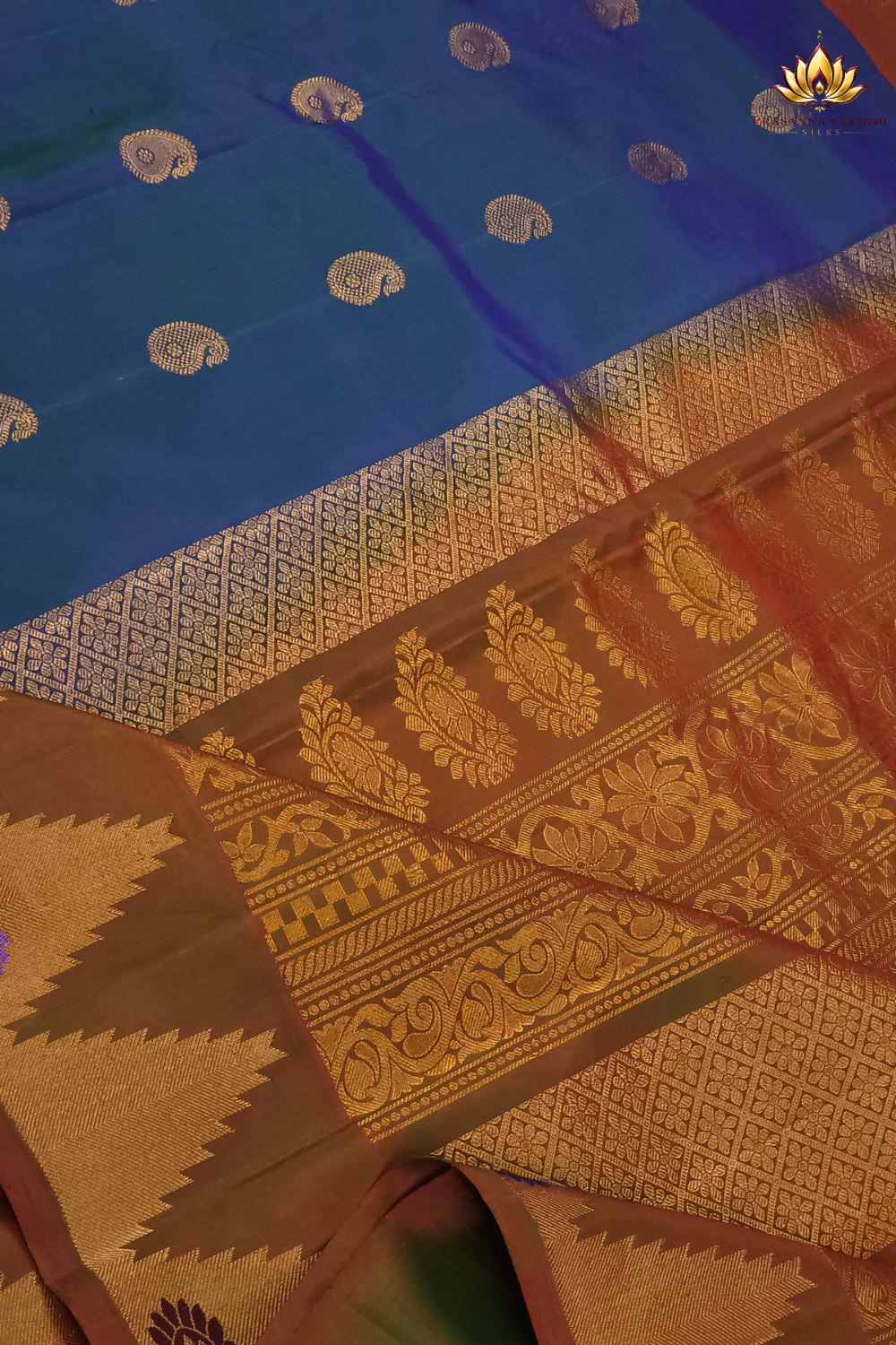 Elegant traditional Gadwal Silk Saree with rich zari weaving, meenakari border detailing, brocade pallu, perfect for weddings and festive occasions.
