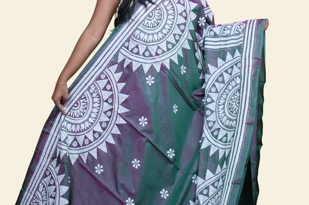 Elegant silk saree featuring Kantha work borders and detailed Kantha pallu design.
