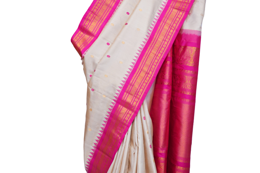 Handloom Gadwal pure silk saree with intricate small zari motifs and rich woven pallu.
