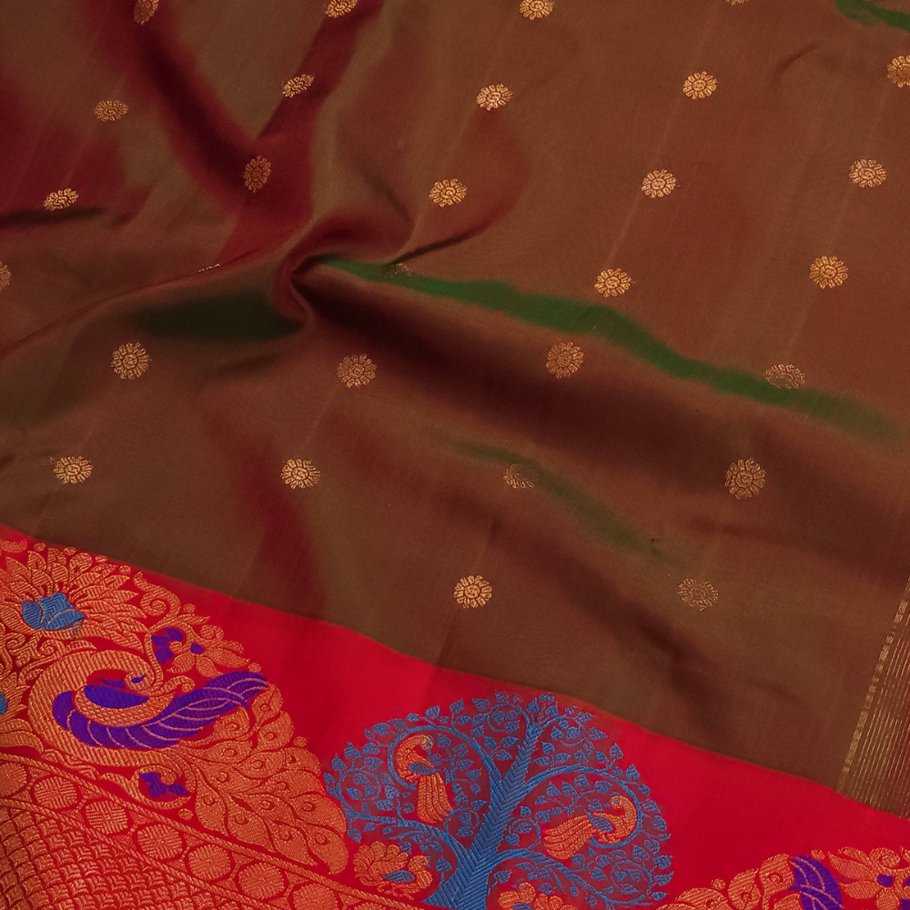 Gadwal Silk Saree featuring all-over zari motifs, intricate meenakari border, rich zari brocade pallu, and contrast blouse.
