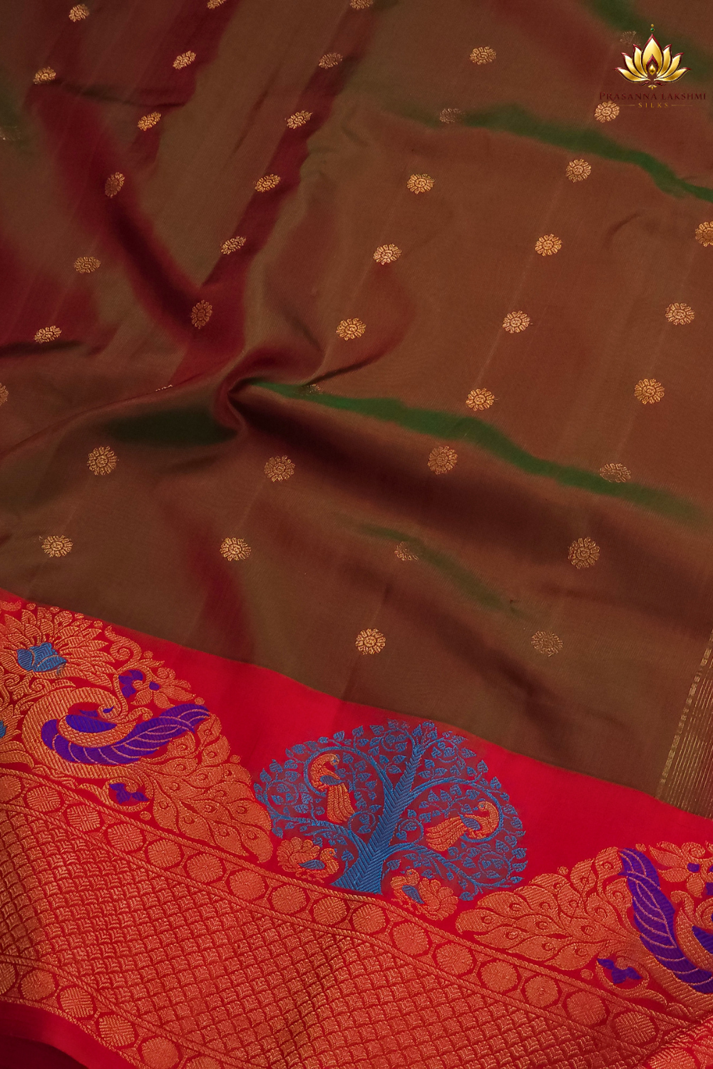 Gadwal Silk Saree featuring all-over zari motifs, intricate meenakari border, rich zari brocade pallu, and contrast blouse.
