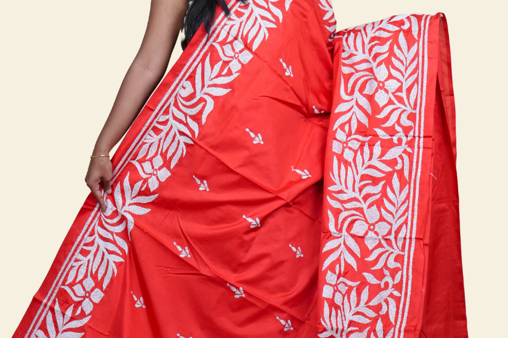 Elegant silk saree featuring Kantha work borders and detailed Kantha pallu design.

