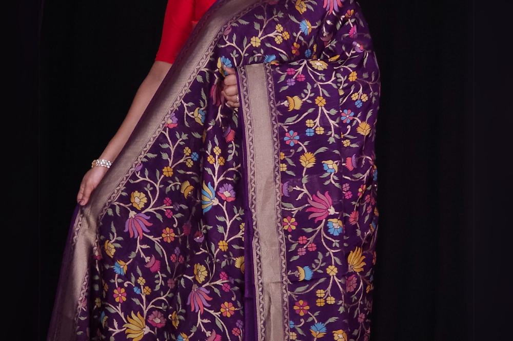 “Elegant floral organza saree with zari border”