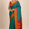 Pure handloom Gadwal cotton saree with traditional zari woven borders and simple zari stripes pallu.
