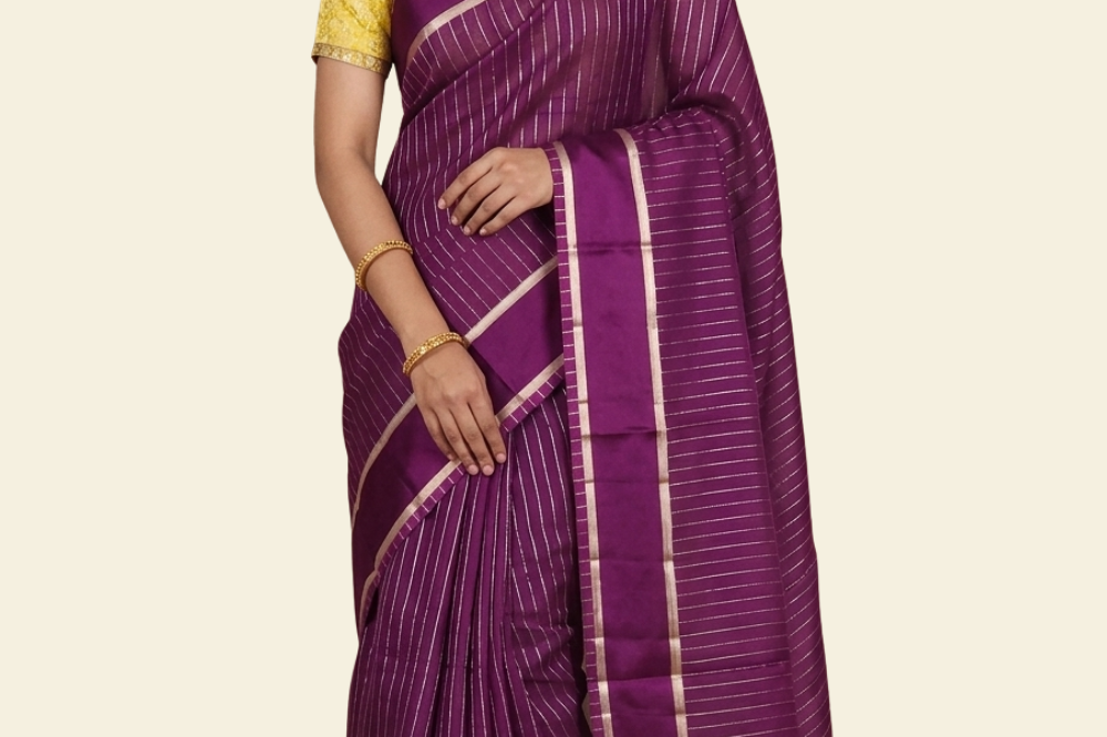 Organza saree with zari woven vertical stripes and plain satin borders
