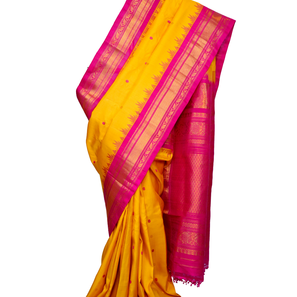 Handloom Gadwal pure silk saree with intricate small zari motifs and rich woven pallu.
