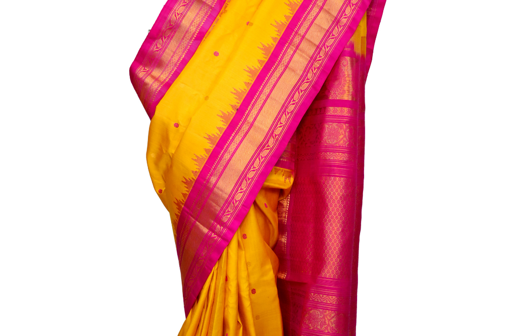 Handloom Gadwal pure silk saree with intricate small zari motifs and rich woven pallu.

