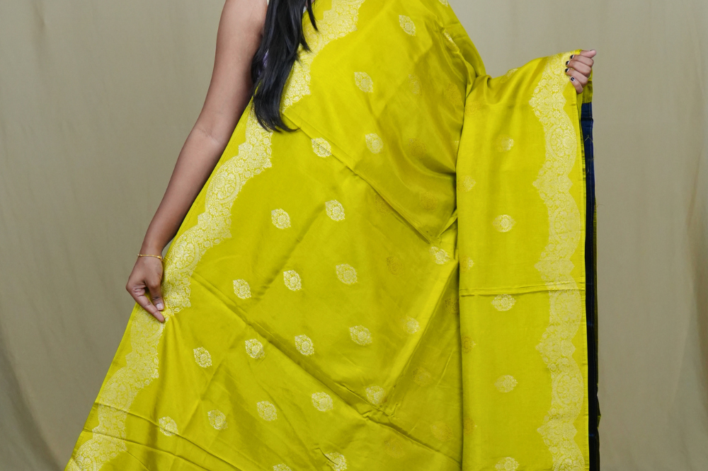 Elegant Banarasi Munga silk saree suitable for all occasions with intricate zari detailing.