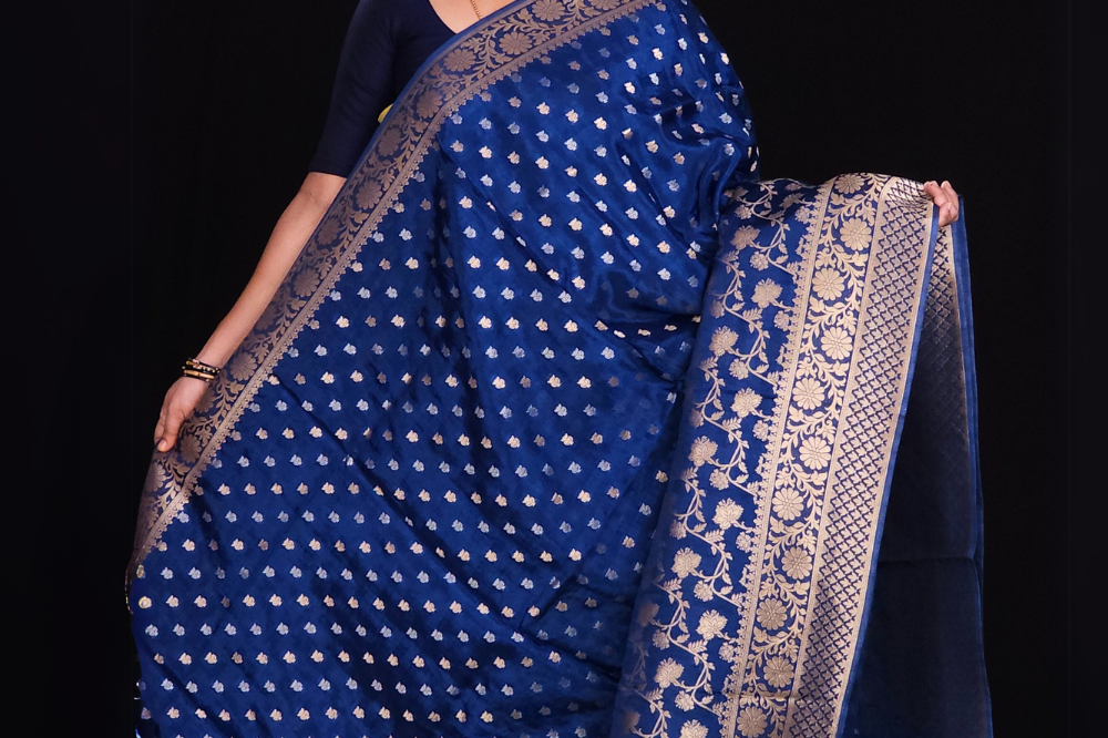  "Prussian Blue Banaras saree with allover floral motifs  gold Zari  border"
