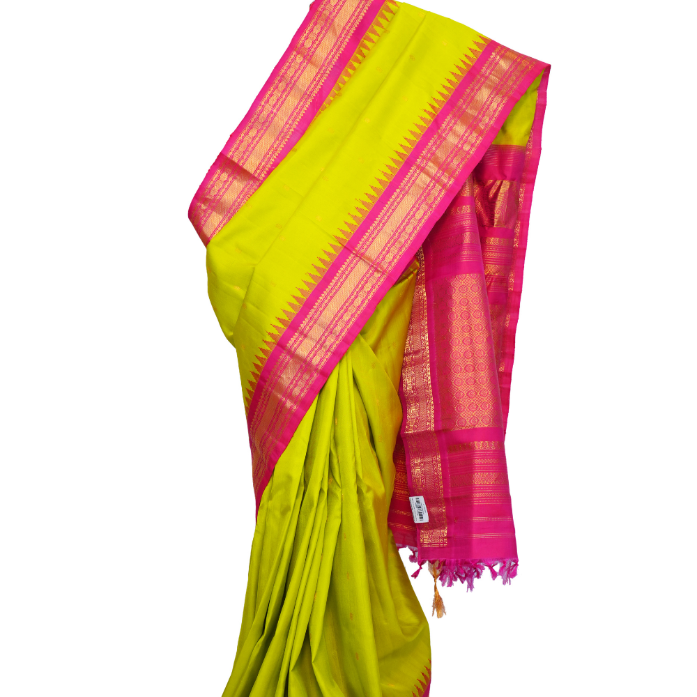 Handloom Gadwal pure silk saree with intricate small zari motifs and rich woven pallu.
