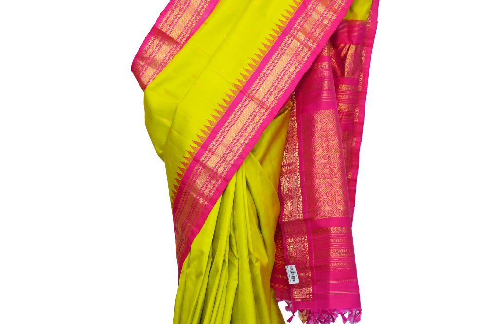 Handloom Gadwal pure silk saree with intricate small zari motifs and rich woven pallu.
