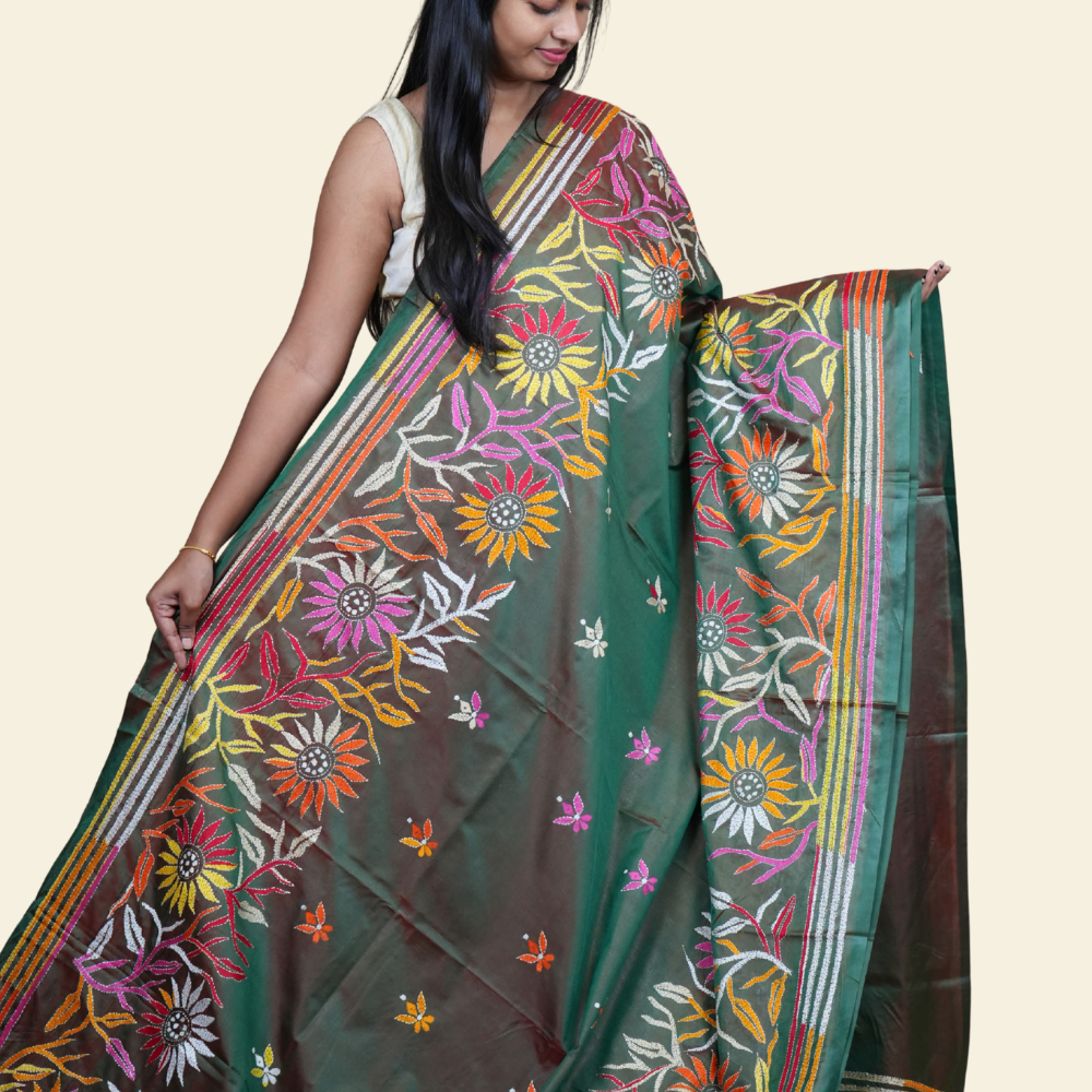 Elegant silk saree featuring Kantha work borders and detailed Kantha pallu design.
