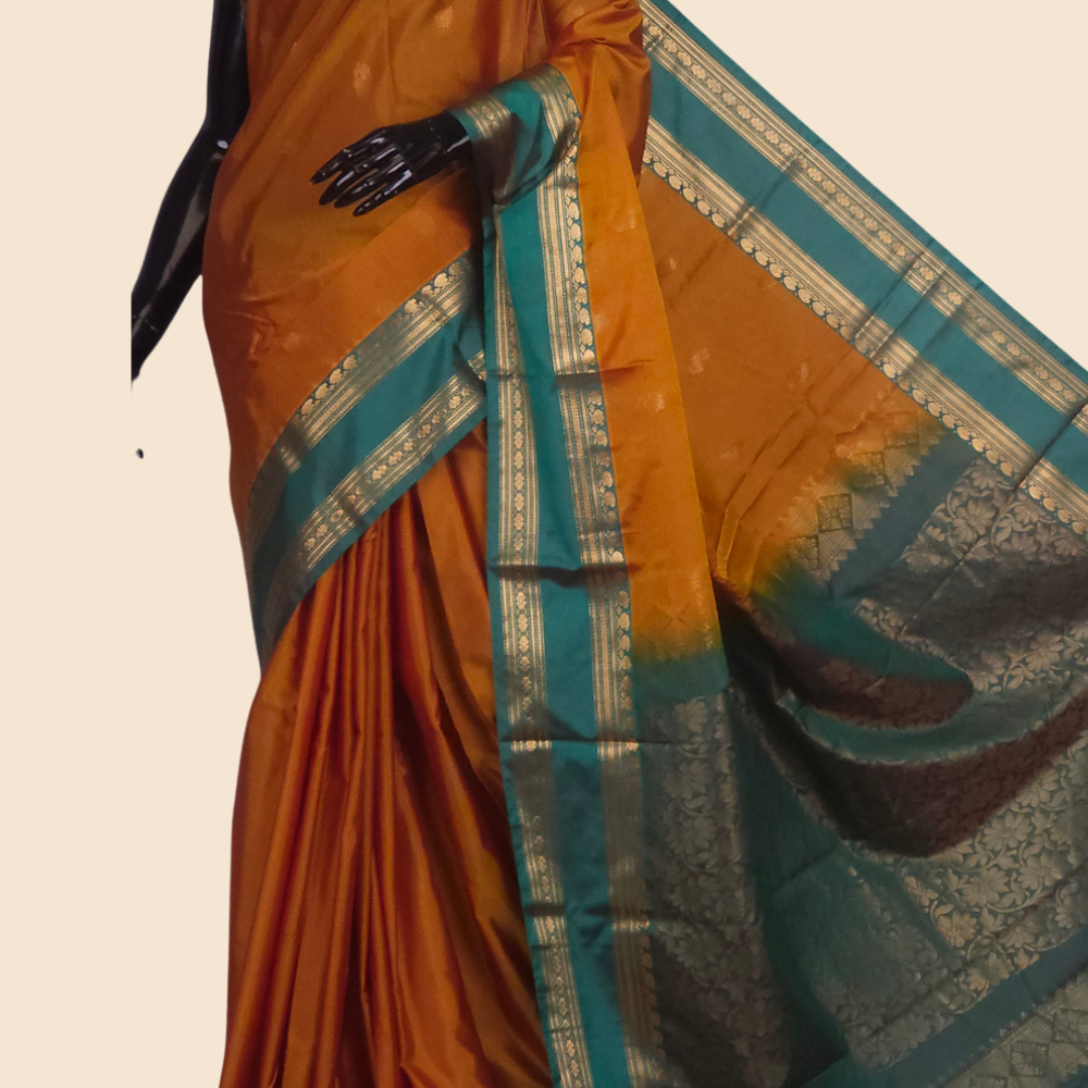 Semi Gadwal saree with horizontal zari motif stripes and zari woven gap borders
