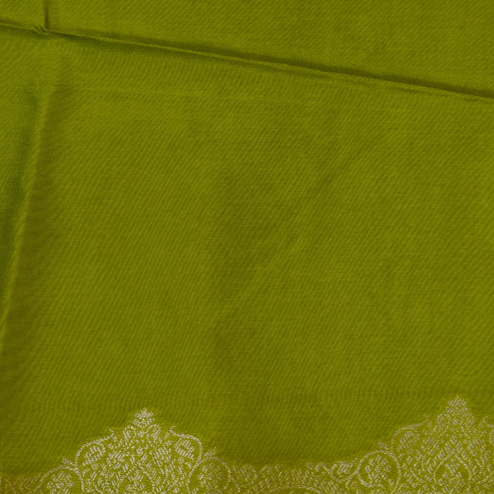 Traditional Banarasi silk saree featuring small zari woven borders and matching blouse with zari motifs.
