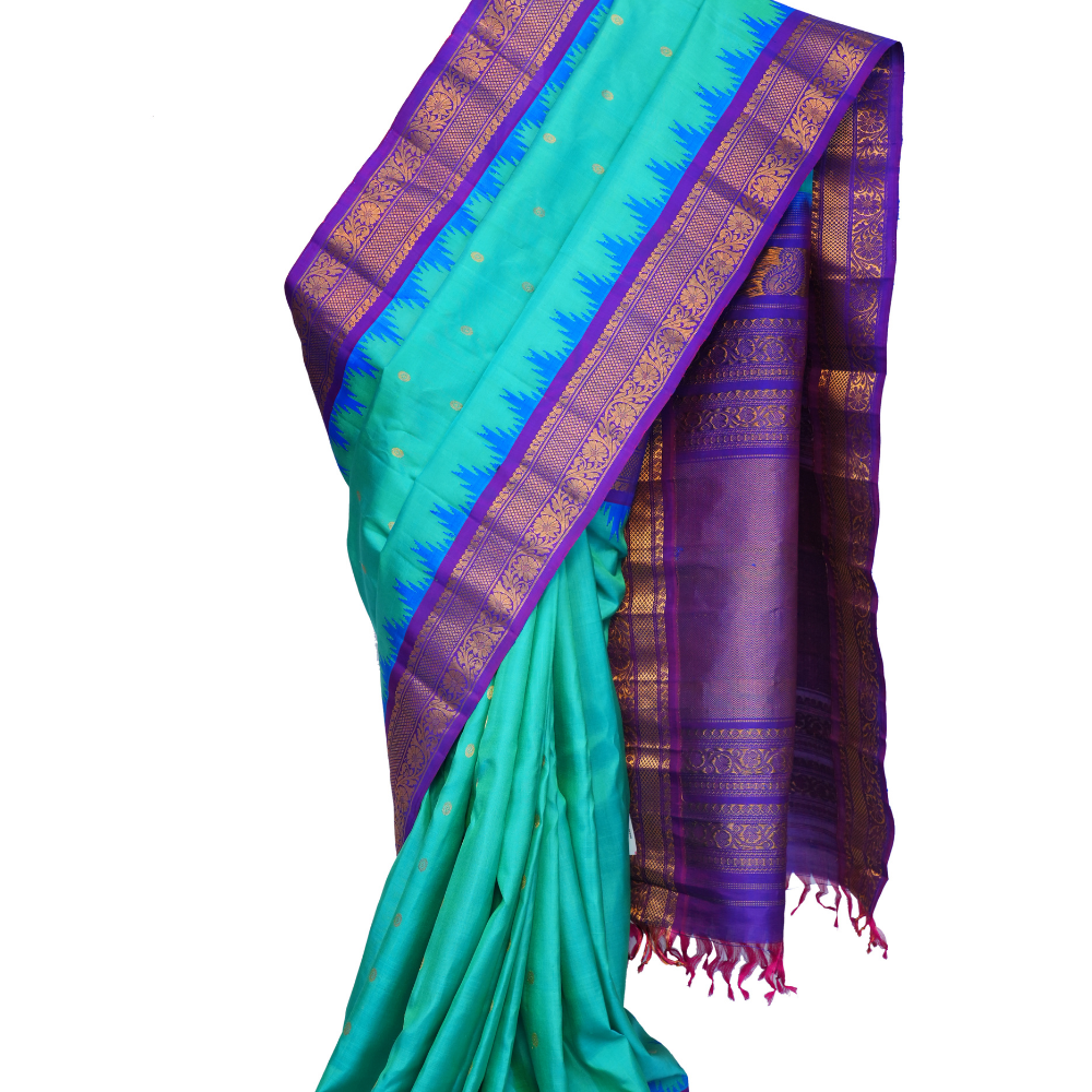 Handloom Gadwal pure silk saree with intricate small zari motifs and rich woven pallu.
