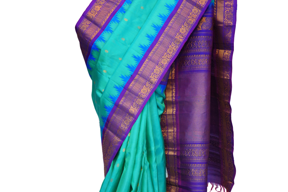 Handloom Gadwal pure silk saree with intricate small zari motifs and rich woven pallu.

