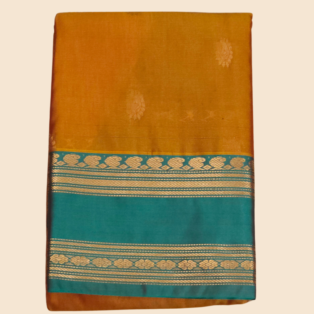 Handloom semi Gadwal saree featuring rich brocade pallu and contrast blouse
