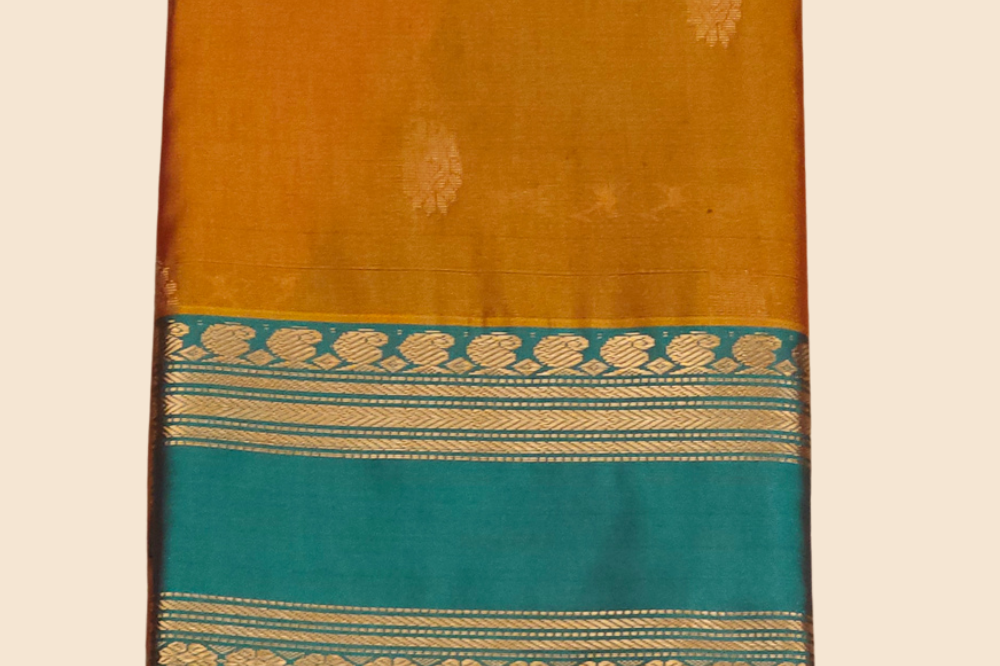Handloom semi Gadwal saree featuring rich brocade pallu and contrast blouse
