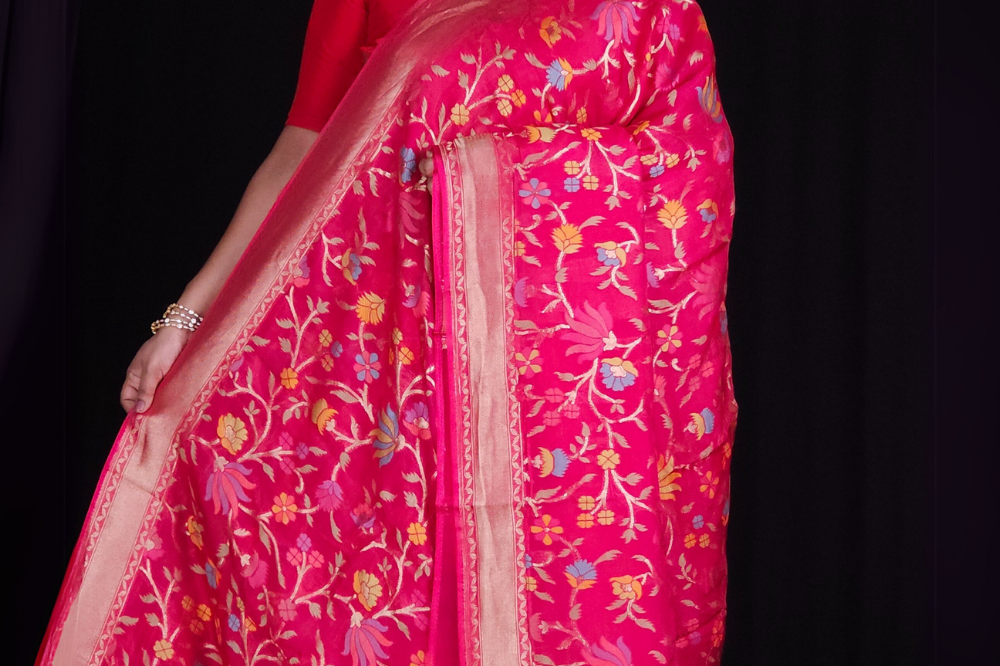 “Elegant floral organza saree with zari border”