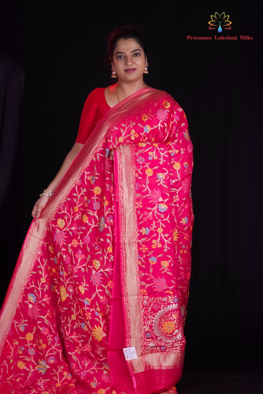 “Elegant floral organza saree with zari border”