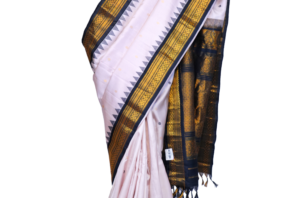 Handloom Gadwal pure silk saree with intricate small zari motifs and rich woven pallu.
